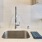 a kitchen with a sink and a towel on the counter