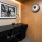 office with seating desk and art on a wall