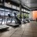 a gym with exercise equipment and rock climbing wall