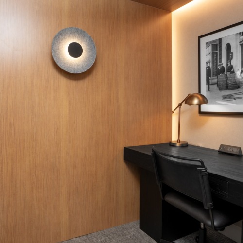 office with seating desk and art on a wall