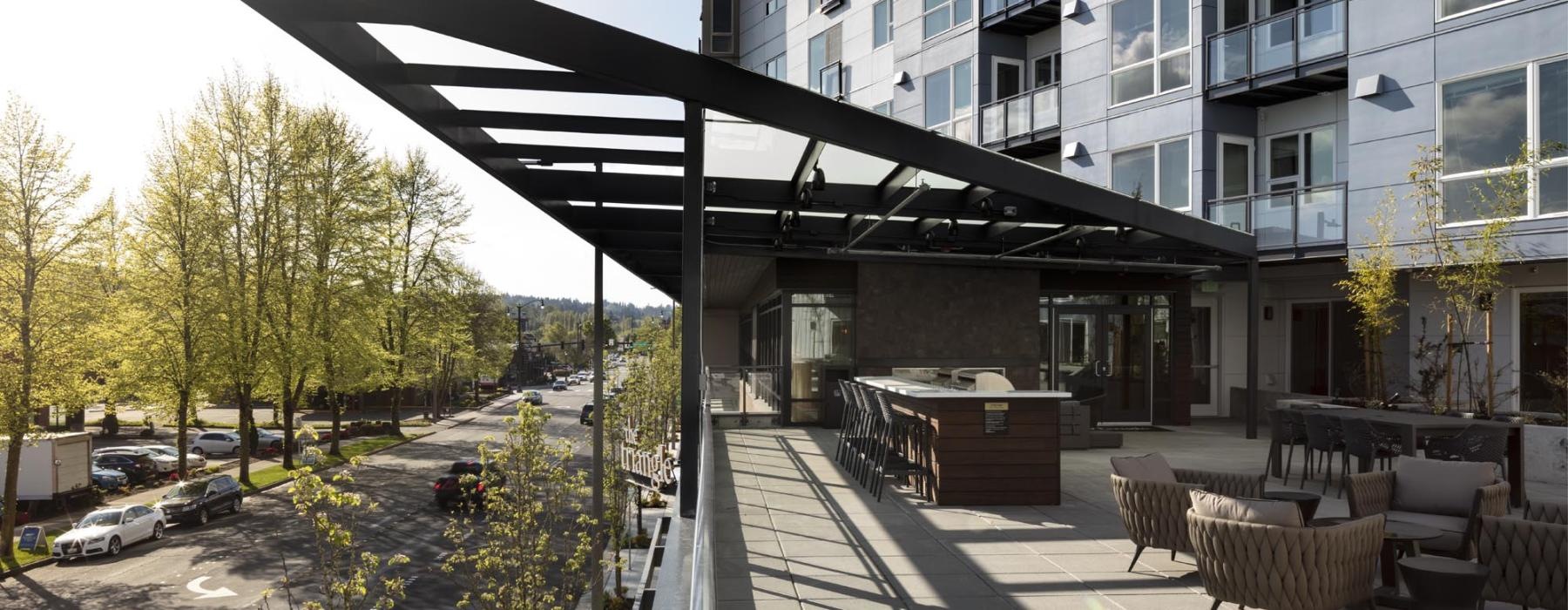 a building with tables and chairs outside