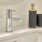 a bathtub with a faucet and a soap dispenser