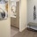 a room with a bench and a painting on the wall