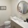 a bathroom with a mirror and sink